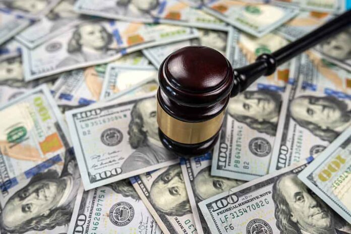 2200663999 featured image Gavel on pile of hundred dollar bills