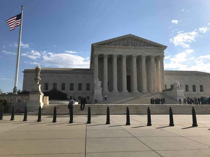 2453289175 featured image U.S. Supreme Court Building with flag and people outside.