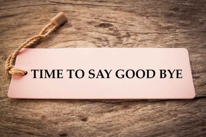 546660592 featured image Sign reads "TIME TO SAY GOOD BYE" on wood.