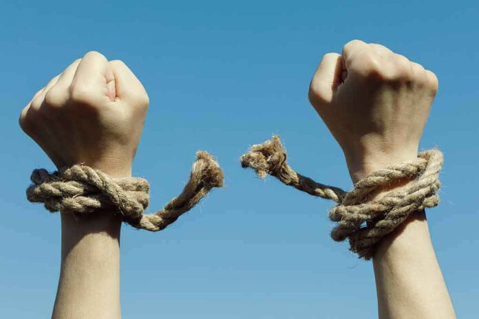 1082949368 featured image Hands with broken rope against blue sky
