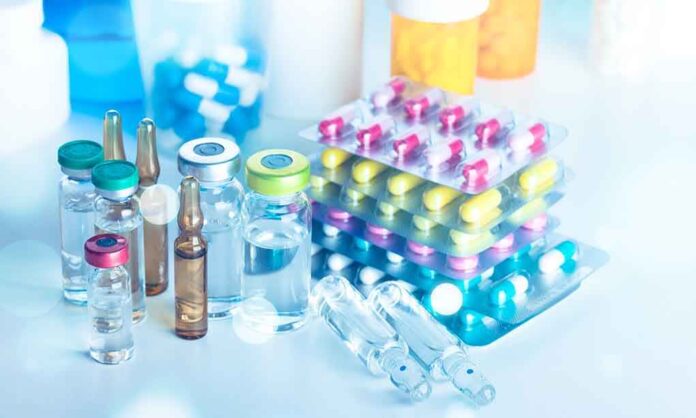 1298903665 featured image Vials and blister packs of pills on table.