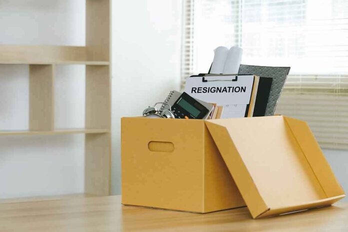 2170196715 featured image Yellow box with resignation notice on an office desk