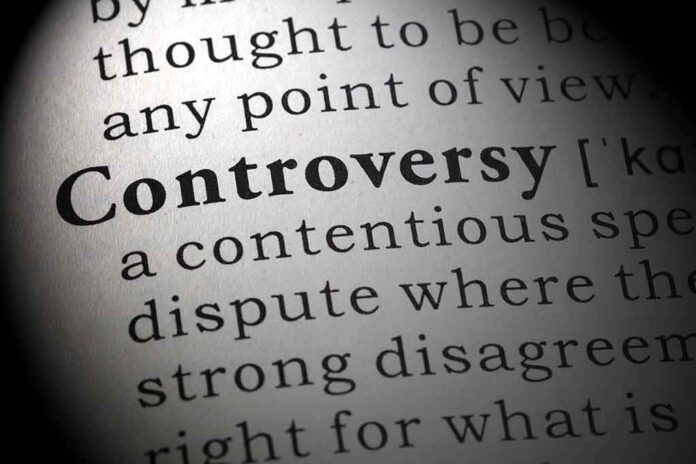386362291 featured image Text magnified to show the word Controversy