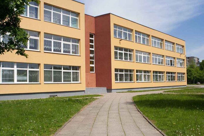 525554962 featured image Threestory yellow building with many windows