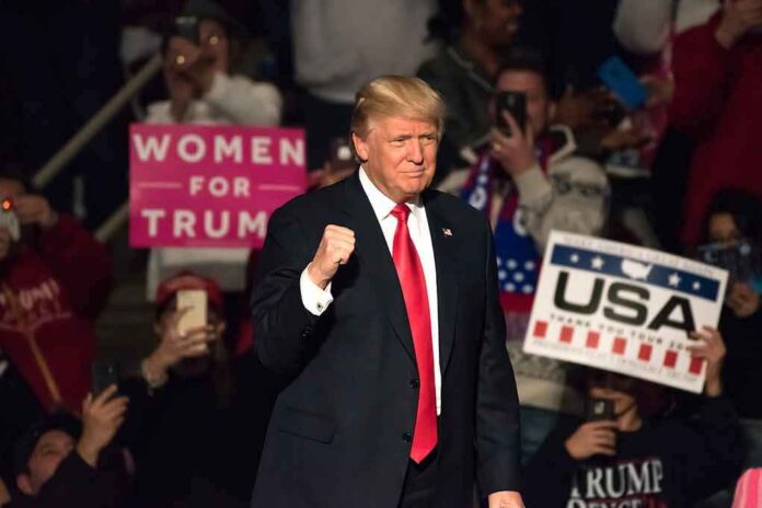 560025514 featured image Man in suit at rally crowd holding signs