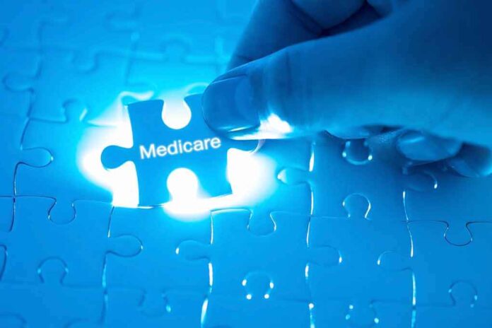 1018157575 featured image Hand placing Medicare puzzle piece under blue light