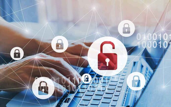 Hands typing on laptop with digital lock icons