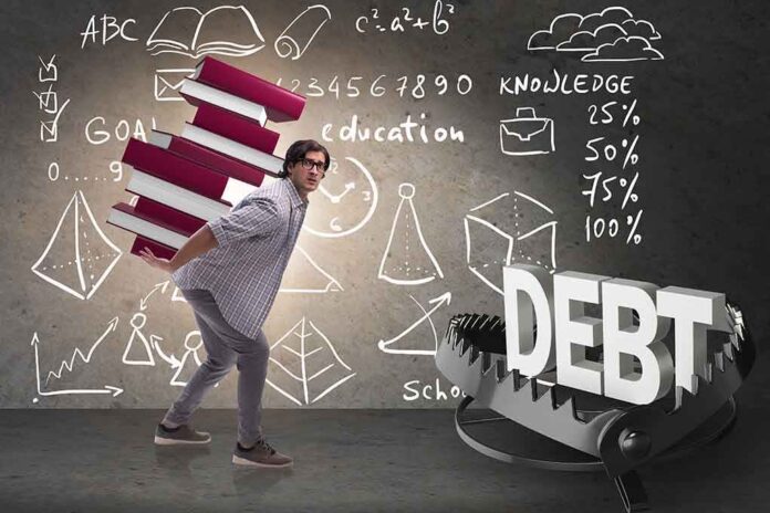 1361502557 featured image Man carrying books, avoiding a trap labeled "DEBT".
