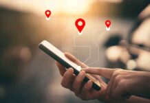 Hands using smartphone with map location icons