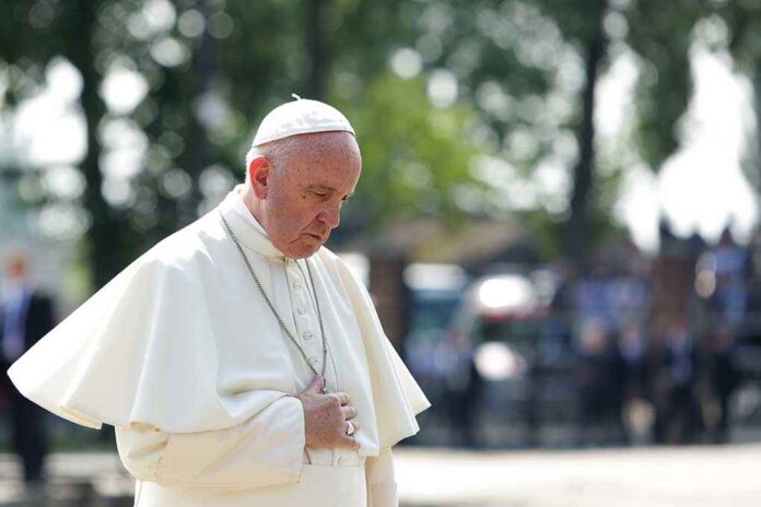 544259368 featured image Man in white religious attire looking down thoughtfully