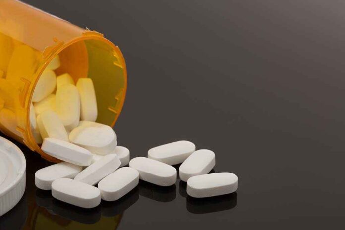 757565809 featured image Spilled prescription bottle with white pills.