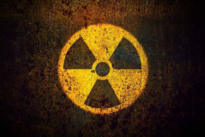 1082372921 featured image Yellow radiation warning symbol on rusty metal surface