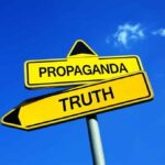 Yellow signs Propaganda left Truth right Blue sky background