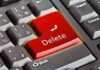 Closeup of a keyboard with red Delete key