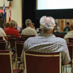 People attending a meeting in a conference room
