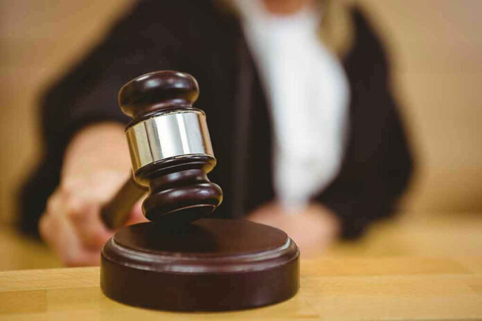 Judge striking gavel in a courtroom