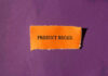 "Product Recall" text on orange paper, purple background.