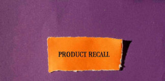 "Product Recall" text on orange paper, purple background.