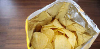 Open bag of ridged potato chips