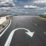 Curved road with a U turn arrow marking