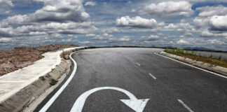 Curved road with a U turn arrow marking