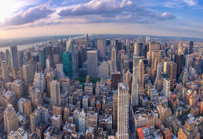 1922605346 Aerial view of city with skyscrapers and cloudy sky