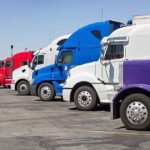 A lineup of colorful trucks parked in a lot