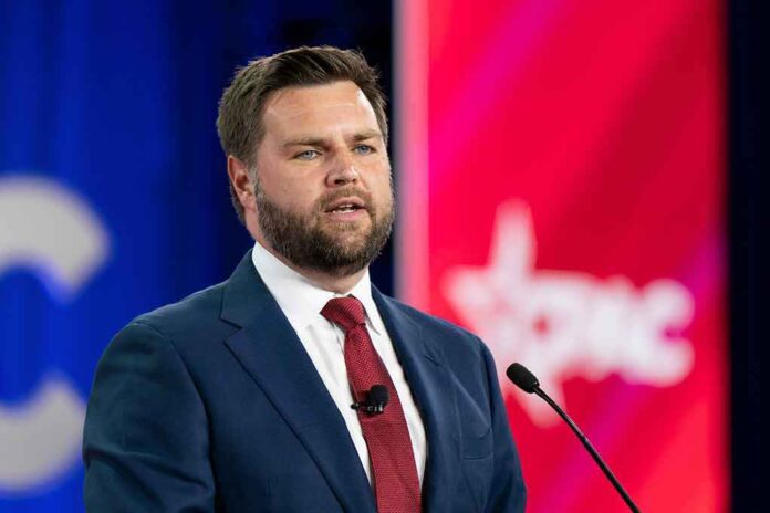 shutterstock_2186937099 (8).jpg A man in a suit speaking at a podium during a conference