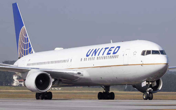 623296490 United Airlines plane on the runway.