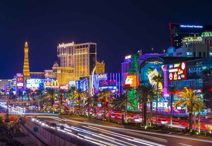 shutterstock_153923993.jpg Vibrant view of the Las Vegas Strip at night with neon lights and traffic