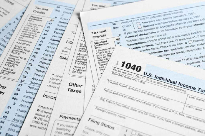 Tax forms and documents overlapping on surface
