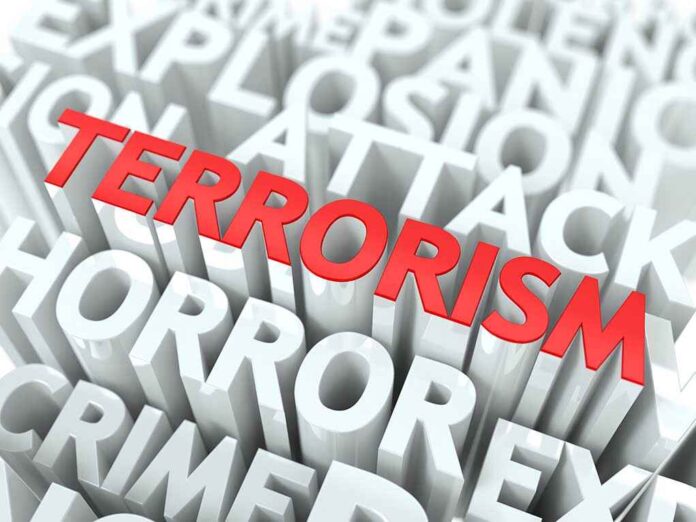 shutterstock_136628645.jpg The word TERRORISM in bold red letters surrounded by related terms in white