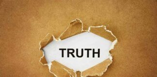 A piece of torn paper revealing the word TRUTH underneath