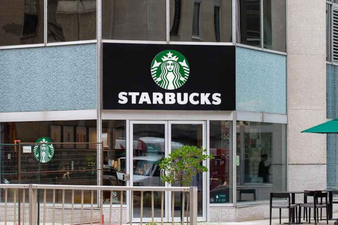 2320394477 Starbucks storefront with glass doors and logo
