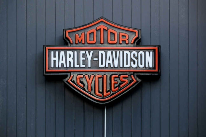 2438820597 Harley-Davidson Motor Cycles logo on dark wall.