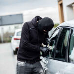 Mayor Praised Defunding Police; Then Her SUV Was Stolen From City Hall Person in black breaking into a car.