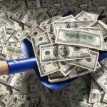 Legal Loophole: Cops Pocket Millions A shovel filled with stacks of cash on a background of scattered dollar bills