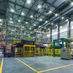 Interior view of a modern industrial facility with manufacturing equipment