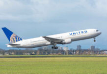 United airplane taking off from a runway.