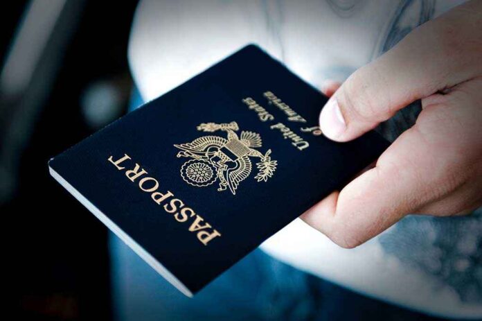 A person holding a United States passport with a dark background