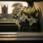 Long-Serving Congressman Passes Away Aged 86 White flowers in a car with blurred background.