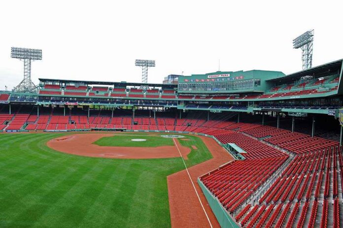 Boston,-,May,23:,Fenway,Park,On,May,23,,2011 View of an empty Fenway Park baseball stadium with green grass and red seats