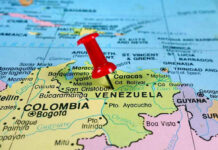 Red pin on Venezuela, South America map.
