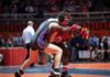 Wrestler Sexually Assaulted by Man Competing As a Female! Two wrestlers competing on a mat during a match