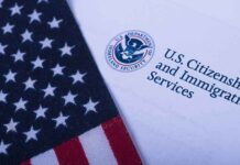Trump Uses Unknown Deportation Rule For The First Time In History American flag beside U.S. immigration document