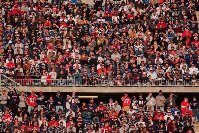 Crowd of fans filling stadium seats