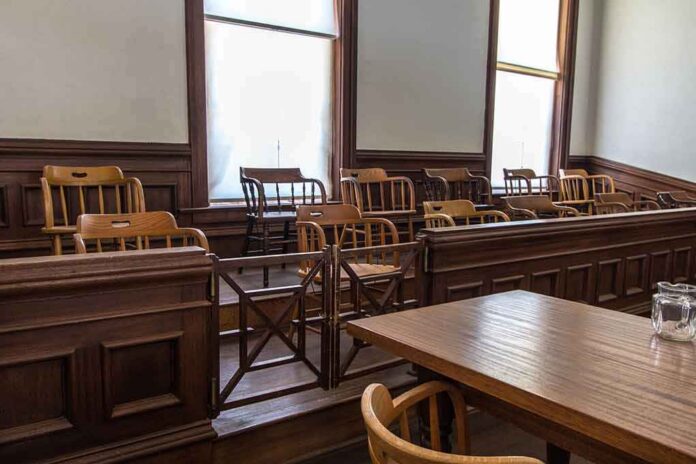 Empty jury box in a courtroom with wooden chairs