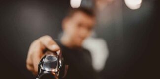 Hair clipper held toward the camera