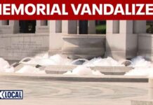 WWII Memorial fountain overflows with bubbles, vandalized with paint