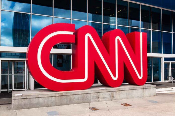 CNN red logo sculpture outside a modern glass building